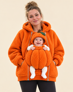 Mum wearing the orange Pumpkin Pouch Hoodie with her baby in the pumpkin pouch